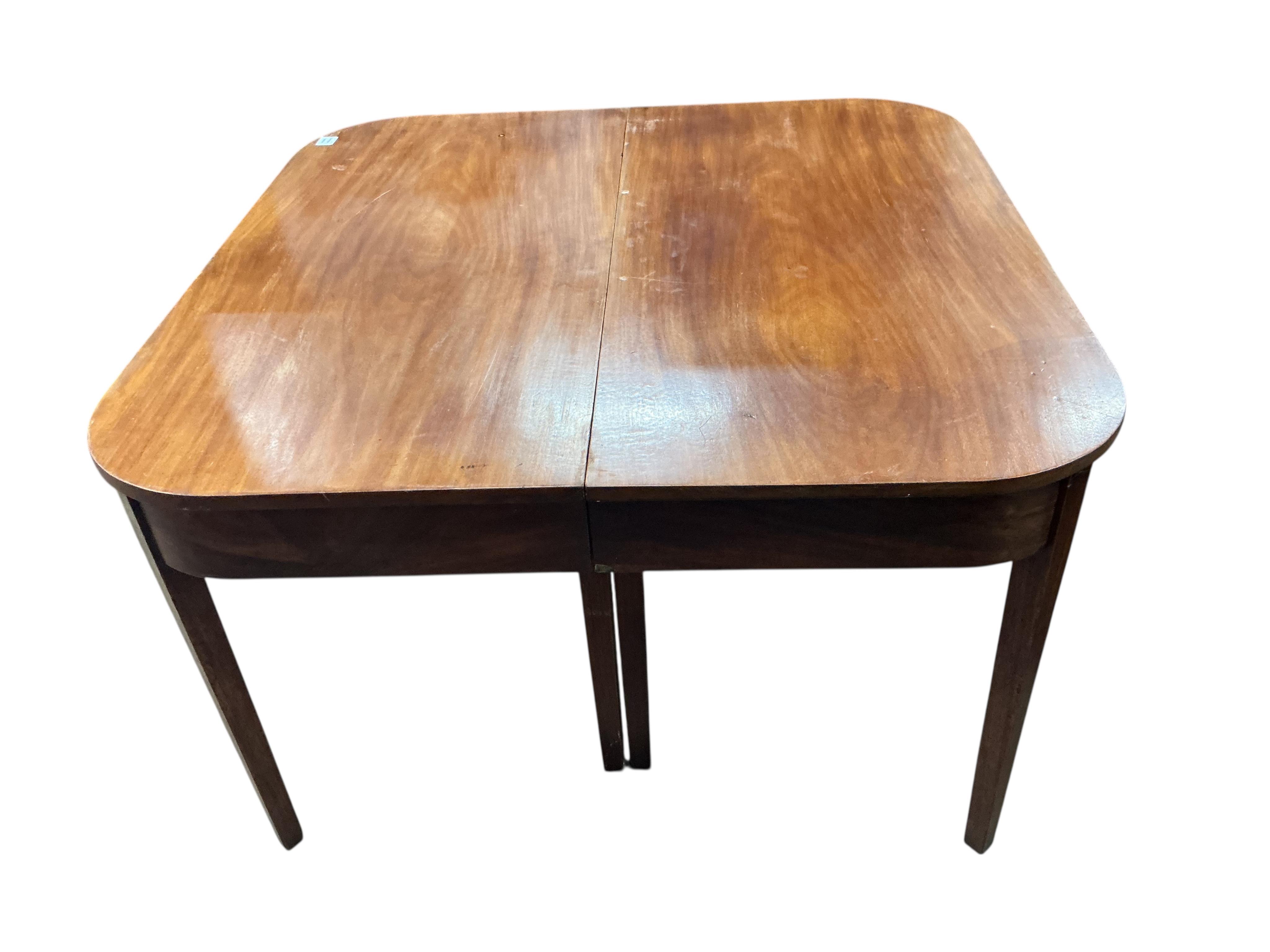 A George III mahogany 'D' end extending dining table, 170cm extended, one spare leaf, no clips for the leaf, depth 120cm, height 73cm